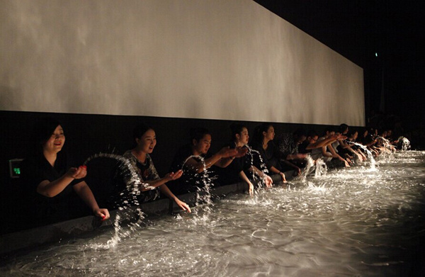 Professional performers make sounds with water during Dadawa's sound art exhibition on Monday, September 15, 2014. [Photo provided by Today Art Museum]