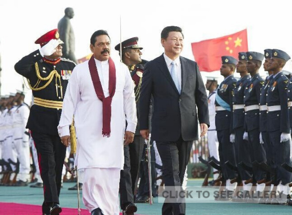 Sri Lankan President Mahinda Rajapaksa (L, front) holds a grand welcoming ceremony for Chinese President Xi Jinping (2nd L, front) in Colombo, Sri Lanka, Sept. 16, 2014. (Xinhua/Huang Jingwen)