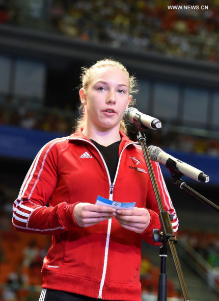 Jordyn Pedersen speaks as representative of athletes during the FIG flag and oaths opening ceremony of the 45th Gymnastics World Championships in Nanning, capital of south China's Guangxi Zhuang Autonomous Region, Oct. 3, 2014. The 45th FIG Artistic Gymnastics World Championships lasts from Oct 3 to 12 in Nanning. (Xinhua/Yang Zongyou) 