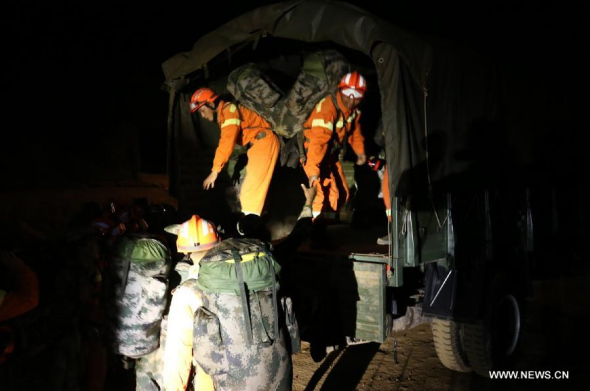 Rescue team members get prepared before setting out for the Jinggu county of Pu'er city for rescue work in Kunming, capital of southwest China's Yunnan province, on Oct. 7, 2014. A 6.6-magnitude earthquake jolted Jinggu County of Pu'er City in Yunnan at 9:49 pm Beijing Time (1349 GMT), according to the China Earthquake Networks Center (CENC). (Xinhua/Meng Leilei)