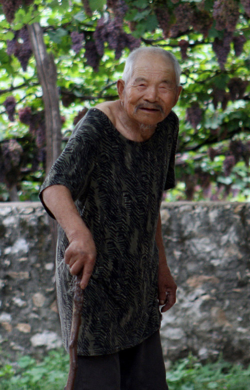 87-year-old Pan Shouli is one of the survivors of the Panjiayu Massacre in which more than 1,000 villagers were killed. Wang Zhuangfei / China Daily