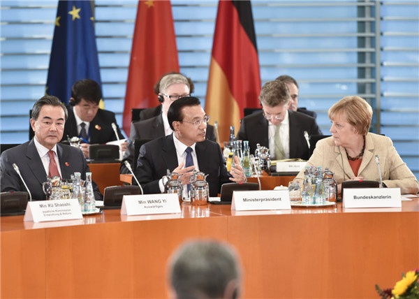 ese Premier Li Keqiang (center, front) and German Chancellor Angela Merkel co-chair the third round of bilateral governmental consultations in Berlin, Germany, Oct 10, 2014. [Photo by Liu Zhen/China News Service]