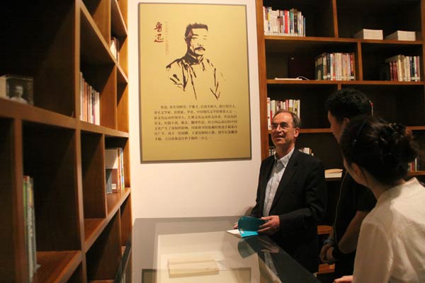In the National Museum of Classic Books, Wilt Idema examines Lu Xun's manuscripts. Provided to China Daily