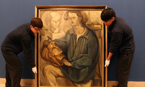 Staff prepare for the Diego Rivera exhibition. Photo: Cui Meng/GT