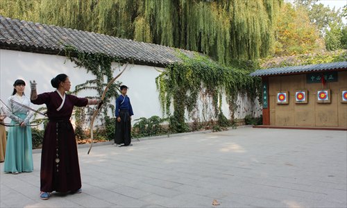 An archery student shoots at a target on the archery range at the Nishan Academy in Shandong Province. Photo: Li Jingjing/GT