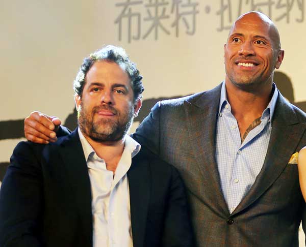 Director Brett Ratner (left) and Hercules' lead actor Dwayne Johnson promote the movie in Beijing last week. The 3-D adventure movie was released in China on Oct 21. [Photo by Jiang Dong/China Daily]