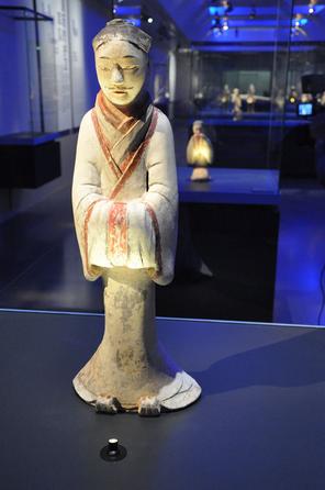 The photo taken on October 21, 2014, shows a pottery figurine of Han Dynasty on display at the Guimet Museum in Paris. [Photo: CRIENGLISH.com]