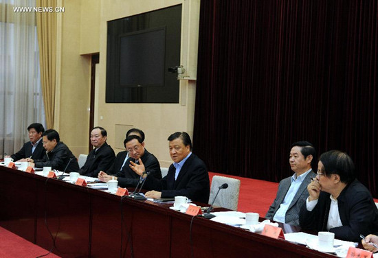 Liu Yunshan (3rd R), a member of the Standing Committee of the Political Bureau of the Communist Party of China (CPC) Central Committee and secretary of the Secretariat of the CPC Central Committee, attends a meeting in Beijing, capital of China, Oct. 25, 2014. At the meeting, Liu urged to study and implement the major tasks laid down at the Fourth Plenary Session of the 18th CPC Central Committee. (Xinhua/Rao Aimin) 