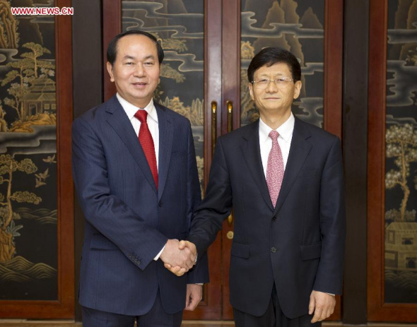 Meng Jianzhu (R), a member of the Political Bureau of the Central Committee of the Communist Party of China (CPC) and also head of the Commission for Political and Legal Affairs of the CPC Central Committee, meets with Vietnamese Minister of Public Security Tran Dai Quang in Beijing, capital of China, Oct. 26, 2014. (Xinhua/Xie Huanchi)