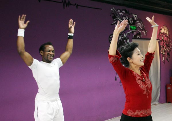 A Chinese square dancer dances during a workship provided by the Imperial Society of Teachers of Dancing. Zou Hong / China Daily