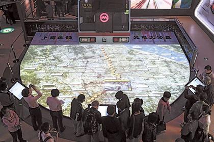Visitors to the Metro museum look at an interactive map of the citys subway network.  Yang Yi