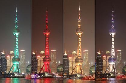 The Oriental Pearl TV Tower is illuminated in four different colors last night ahead of the World Cities Day today.  Zhang Suoqing