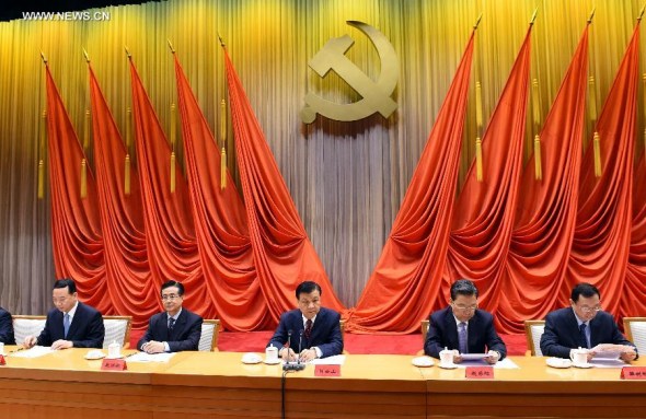 Liu Yunshan (C), president of the Party School of the Communist Party of China (CPC) Central Committee and a member of the Standing Committee of the Political Bureau of the CPC Central Committee, attends the graduation ceremony of the Party School of the CPC Central Committee in Beijing, capital of China, Nov. 5, 2014. (Xinhua/Rao Aimin)