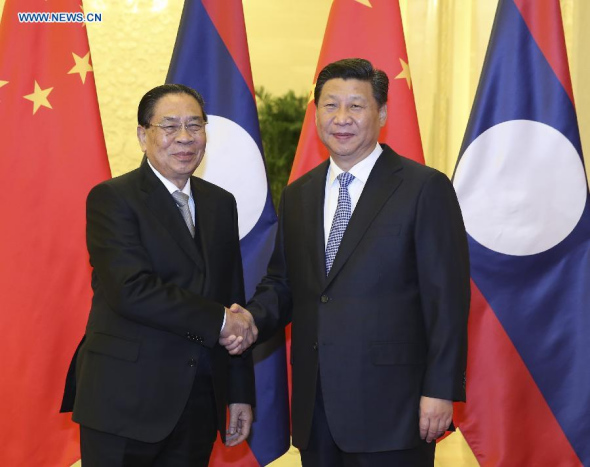 Chinese President Xi Jinping (R) meets with Lao President Choummaly Sayasone at the Great Hall of the People in Beijing, capital of China, Nov. 8, 2014. (Xinhua/Ding Lin)