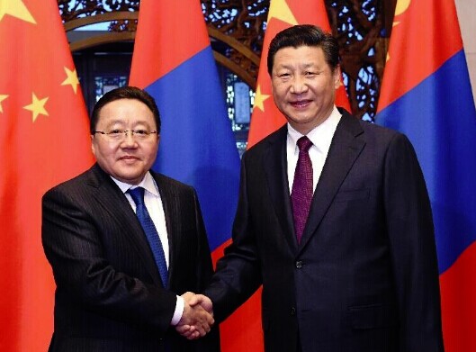 Chinese President Xi Jinping (R) shakes hands with Mongolian President Tsakhiagiin Elbegdorj in Beijing, capital of China, Nov. 8, 2014. (Xinhua/Rao Aimin)