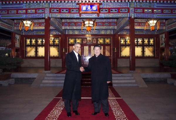 Chinese President Xi Jinping (R) and his US counterpart Barack Obama shake hands at the Zhongnanhai leadership compound in Beijing, capital of China, Nov. 11, 2014. Xi Jinping held a bilateral meeting with visiting US President Barack Obama in Beijing Tuesday evening. (Xinhua/Ju Peng)