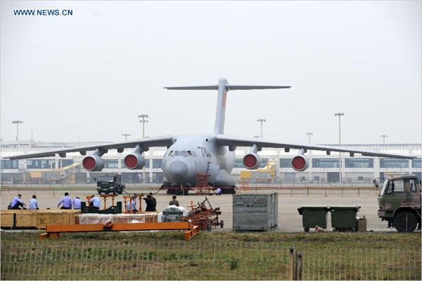 A Y-20 military transport aircraft of the Aviation Industry Corporation of China is seen ahead of the 10th China International Aviation and Aerospace Exhibition in Zhuhai, South China's Guangdong Province, Nov 10, 2014. [Photo/Xinhua] 