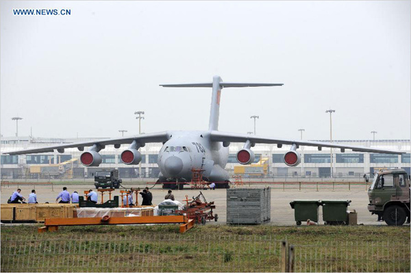 A Y-20 military transport aircraft of the Aviation Industry Corporation of China is seen ahead of the 10th China International Aviation and Aerospace Exhibition in Zhuhai, South China's Guangdong Province, Nov 10, 2014. [Photo/Xinhua] 