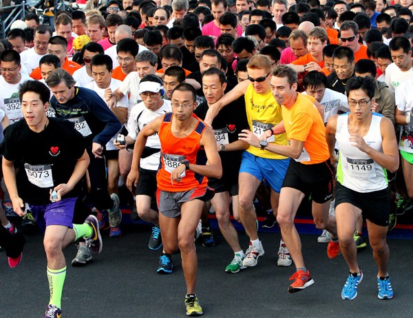 Participants in the JP Morgan's Corporate Challenge in Shanghai on Oct 18. The healthy lifestyle campaign was initiated in New York in 1977 before spreading to Australia, UK, Germany, Singapore and South Africa. It came to China in 2011. [Provided to China Daily]