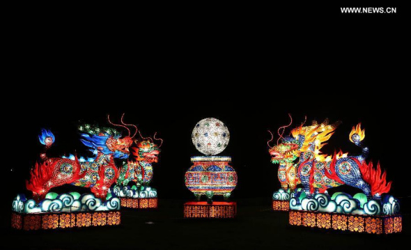 Qilin-shaped lanterns are seen at the illumination ceremony for the Chinese Festival of Light in Longleat of Wiltshire, southwest England, on Nov 12, 2014. Qilin is a kind of mythical creature having the head of a dragon and the body of a tiger or deer. More than 100 workers from Zigong City of southwest China's Sichuan province have made 7,000 lanterns, which will be displayed at the Chinese Festival of Light lasting from Nov 14 to next January. (Xinhua/Han Yan) 