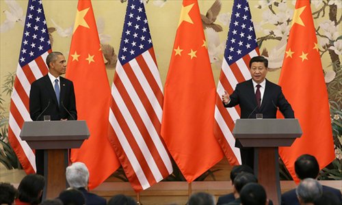 Chinese President Xi Jinping speaks at a joint press conference alongside US President Barack Obama at the Great Hall of the People in Beijing on Wednesday. Photo: Xinhua