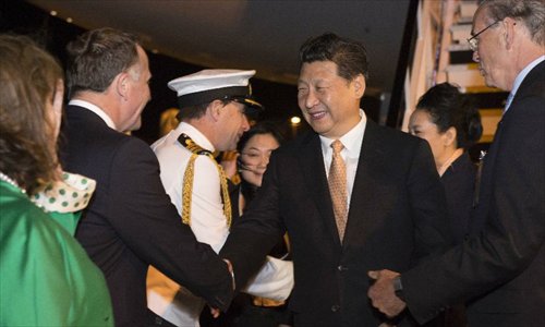 Chinese President Xi Jinping (3rd R) and his wife Peng Liyuan (2nd R) arrive at the airport of Auckland, New Zealand, on Nov. 19, 2014. Xi Jinping arrived Wednesday in Auckland to start his state visit to New Zealand at the invitation of Governor-General Sir Jerry Mateparae and Prime Minister John Key. Photo: Xinhua
