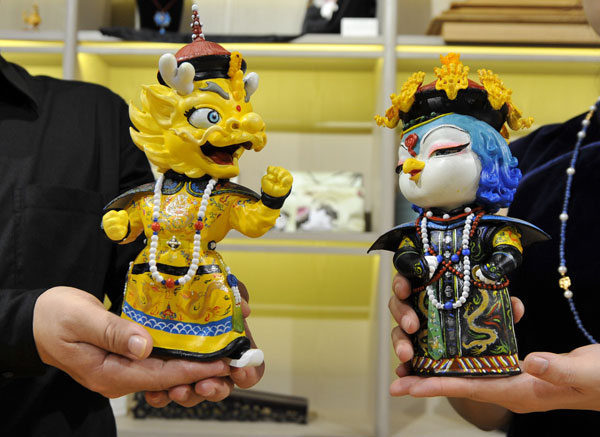 The Palace Museum unveils its dragon and phoenix mascots Zhuangzhuang and Meimei on Sunday. PROVIDED TO CHINA DAILY  
