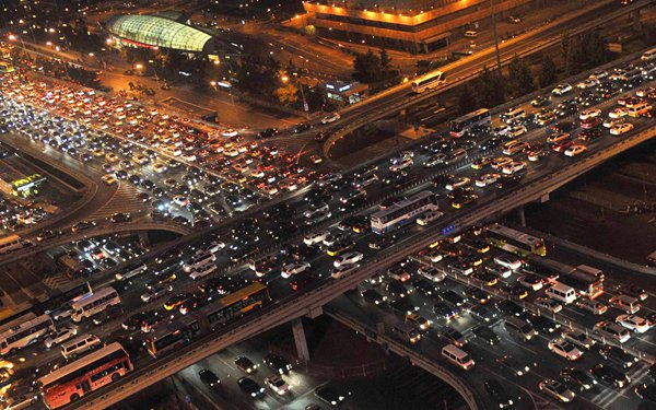 Traffic gridlock in Beijing's Central Business District. The rapid rise in the number of vehicles on the roads has resulted in congestion becoming a major problem in China's modern cities.[GONG LEI/XINHUA]  