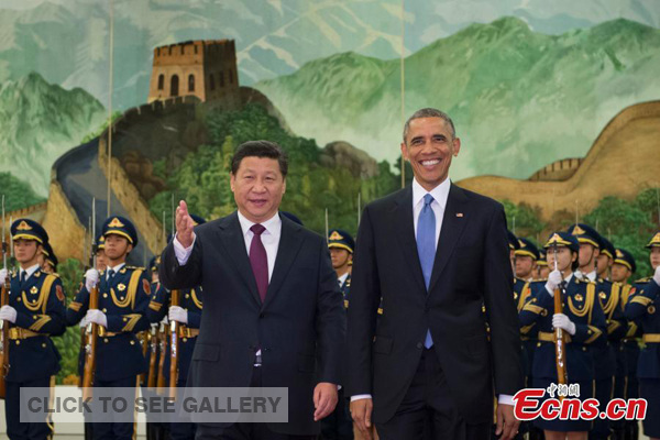 Chinese President Xi Jinping (L) holds a welcoming ceremony for his US counterpart Barack Obama at the Great Hall of the People in Beijing on Wednesday, Nov 12, 2014. [Photo: China News Service/Du Yang]