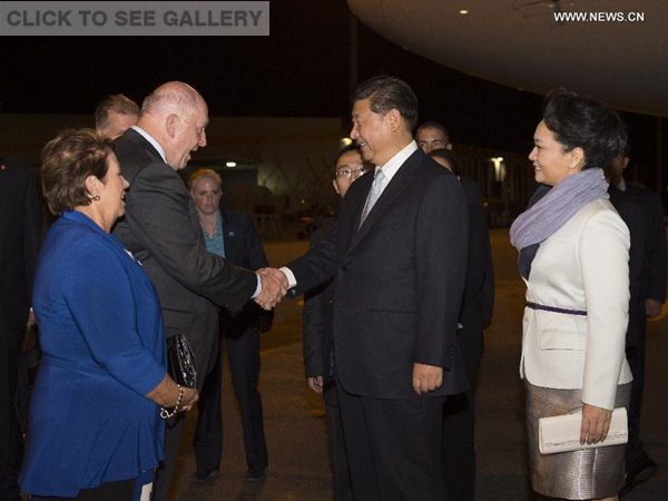 Chinese President Xi Jinping (2nd R, front) and his wife Peng Liyuan (1st R, front) are welcomed by Australian Governor-General Peter Cosgrove (2nd L, front) and his wife upon their arrival in Brisbane, Australia, Nov 14, 2014. (Xinhua/Li Xueren) 