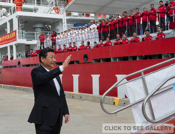 President Xi Jinping waves to the crew of Chinese icebreaker Xuelong during his visit to Hobart, Australia, on Tuesday. Xi stopped in the Australian state of Tasmania after attending the G20 Summit in Brisbane over the weekend. LI XUEREN / XINHUA