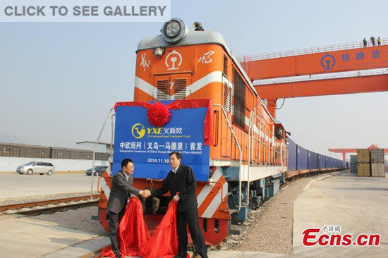The first train linking Yiwu in East China's Zhejiang province and Madrid in Spain is put into operation after an inauguration ceremony held in Yiwu, the world's largest wholesale market for small consumer goods on November 18, 2014. A train with 82 containers was the first to travel the entire course of the "Yixin'ou" cargo line, which starts from Yiwu enters into Central Asia from China's Xinjiang and traverses Europe to reach its terminus in Spain. It takes 21 days to travel the entire course of the line. [Photo: China News Service/ Zhu Zhijun] 