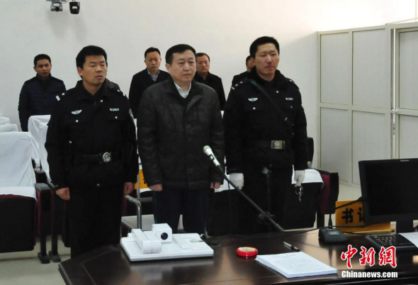 Zhang Xiaodong, former secretary of the Anyang municipal committee of the Communist Party of China (CPC), is in Zhumadian Intermediate People's Court on Dec 5, 2014. [Photo: China News Service/ Wang Zhongju]