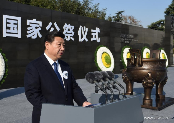Chinese President Xi Jinping addresses a state commemoration for China's first National Memorial Day for Nanjing Massacre Victims in Nanjing, east China's Jiangsu province, Dec 13, 2014. (Xinhua/Li Xueren) 