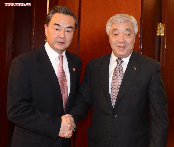 Chinese Foreign Minister Wang Yi (L) meets with Kazakh Foreign Minister Erlan Idrisov in Astana, Kazakhstan, on Dec. 15, 2014. (Xinhua/Sadat)