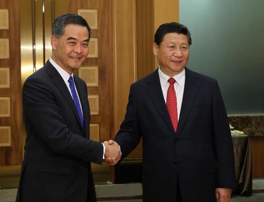 Chinese President Xi Jinping (R) meets with Leung Chun-ying, chief executive of China's Hong Kong Special Administrative Region, in south China's Macao, Dec. 19, 2014. (Xinhua/Lan Hongguang)