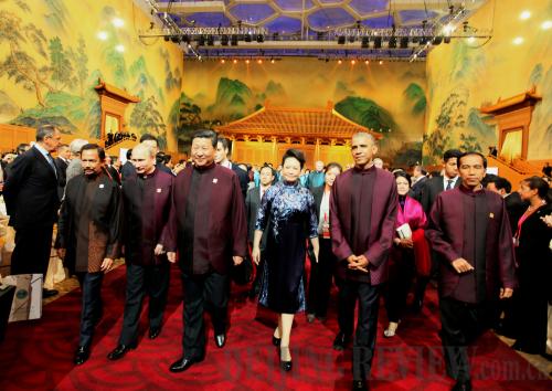 FORGING AHEAD: Chinese President Xi Jinping (fourth right) and his wife Peng Liyuan (third right) along with foreign leaders, attend a welcoming banquet for the 22nd Asia-Pacific Economic Cooperation Economic Leaders' Meeting in Beijing November 10 (LAN HONGGUANG)