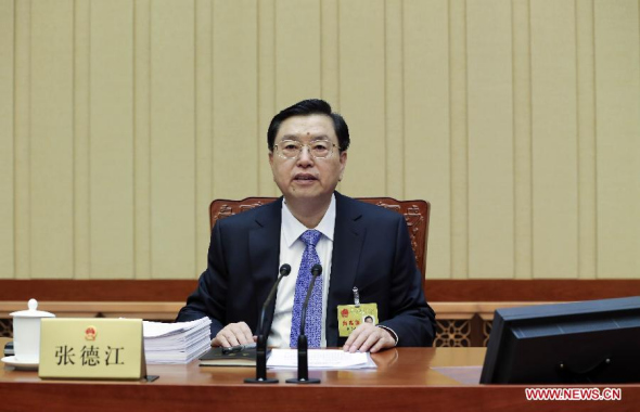 Zhang Dejiang, chairman of the Standing Committee of the National People's Congress (NPC), presides over the 12th meeting of the 12th NPC Standing Committee in Beijing, capital of China, Dec 22, 2014. (Xinhua/Ding Lin)