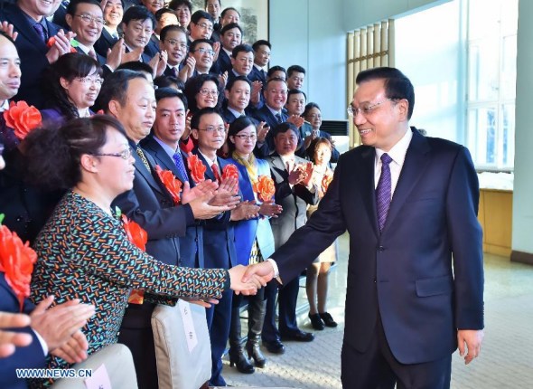 Chinese Premier Li Keqiang (1st R), also a member of the Standing Committee of the Political Bureau of the Communist Party of China (CPC) Central Committee, meets with prominent auditing personnel from across the country in Beijing, capital of China, Dec. 25, 2014. (Xinhua/Li Tao)