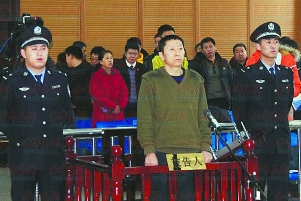 Qi Quanjun stands at the court on Dec 19, 2014. [Photo/Xinhua]