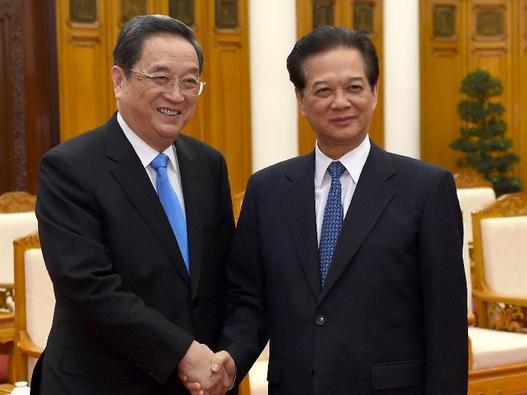 Yu Zhengsheng (L), a member of the Standing Committee of the Political Bureau of the Communist Party of China (CPC) Central Committee and chairman of the National Committee of the Chinese People's Political Consultative Conference, meets with Vietnamese Prime Minister Nguyen Tan Dung in Hanoi, capital of Vietnam, Dec. 26, 2014. (Xinhua/Ma Zhancheng)