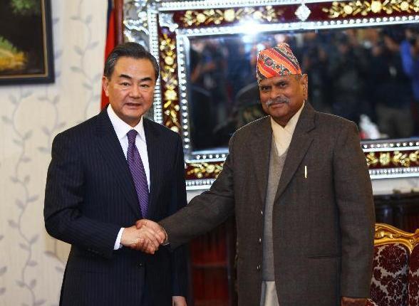 Chinese Foreign Minister Wang Yi (L) meets with Nepalese President Ram Baran Yadav at the President's Residence in Kathmandu, Nepal, Dec. 26, 2014. A Chinese delegation led by Foreign Minister Wang Yi arrived here on Thursday for a three-day official goodwill visit, the highest level one from the Chinese side after the election of Nepal's Constituent Assembly in November 2013. (Xinhua/Pratap Thapa)