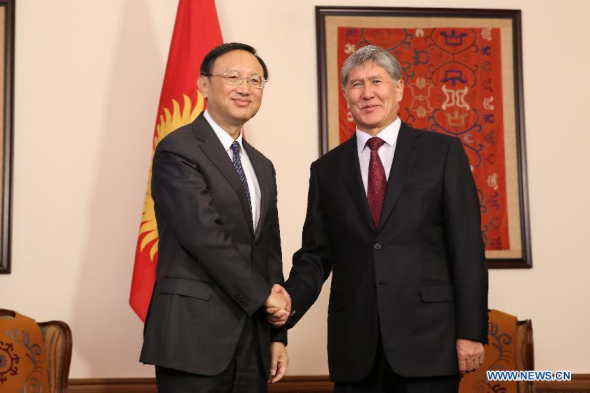 Kyrgyz President Almazbek Atambaev (R) meets with Yang Jiechi, Chinese State Councilor and special envoy of Chinese President Xi Jinping, in Bischkek, Kyrgyzstan, on Dec. 29, 2014. (Xinhua/Chen Yao)