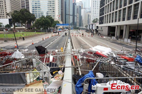 Removed road blocks are seen stacked on a street in Hong Kong on Wednesday, December 10, 2014. Hong Kong's Chief Secretary Carrie Lam on Wednesday appealed to protesters to pack their belongings and leave occupied areas before Hong Kong police start clearance operations on Thursday. [Photo: China News Service/ Hong Shaokui]