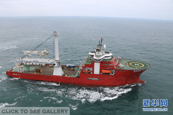 Photo taken on Dec 30, 2014 shows Chinese rescue vessel Nanhaijiu 101 berthed in a port of Haikou, capital of south China's Hainan province. China announced on Dec 29, 2014 that it will send aircraft and vessel to join the search and rescue work for missing AirAsia flight QZ8501. By far, a navy frigate on routine patrol in the South China Sea is heading for the waters where the jet went missing. Besides, Chinese patrol ship Haixun 31, rescue vessel Nanhaijiu 101 and Nanhaijiu 115 are also standing by. (Xinhua/Zhao Yingquan) 