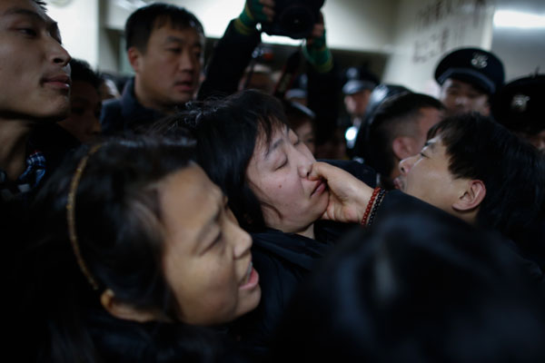 A relative of a stampede victim is given first aid at the Shanghai General Hospital early on Thursday morning. [Photo provided to China Daily]