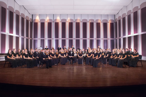 Members of the Augustana College Band pose for a photo on stage at the school's performance hall, the Washington Pavilion. A group of 60 students left for China this week as part of a 23-day tour of the country. Provided to China Daily.  
