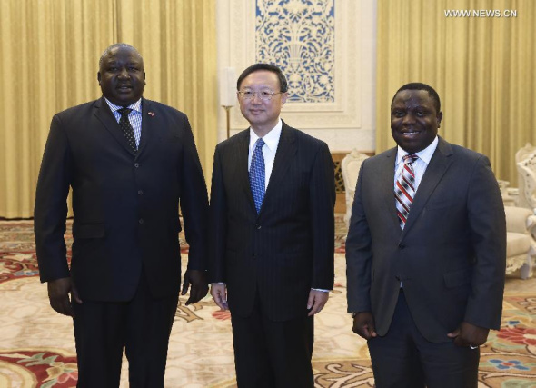 Chinese State Councilor Yang Jiechi (C) meets with Foreign Minister of Zambia Harry Kalaba (R) and State Minister for Foreign Affairs of Uganda Henry Oryem Okello in Beijing, capital of China, Jan. 6, 2015. (Xinhua/Pang Xinglei)