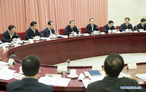 Yu Zhengsheng (5th R), chairman of the National Committee of the Chinese People's Political Consultative Conference (CPPCC), presides over a biweekly symposium of the CPPCC in Beijing, capital of China, Jan. 8, 2015. (Xinhua/Huang Jingwen)