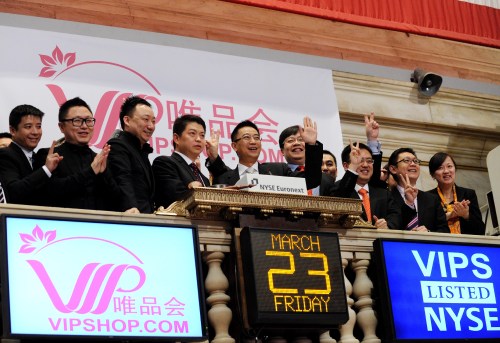 WE ARE THE CHAMPIONS: Vipshop Holdings Ltd. representatives celebrate their listing on the New York Stock Exchange on March 23, 2012. The website dedicates itself to providing discounted brand products to Chinese female shoppers (AN XIYA)